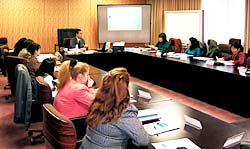 Participants from eight countries listening earnestly to a lecture on gender